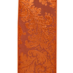 Load image into Gallery viewer, Front view of copper velvet wired edge ribbon featuring an elegant filigree pattern over a coordinating dupioni-style base.