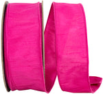 Load image into Gallery viewer, A partial, loose curl of the 2.5-inch wide Dupioni Supreme Wired Edge Ribbon, highlighting its solid vibrant fuchsia color, slubbed fabric texture, and a matching stitched wire edge.