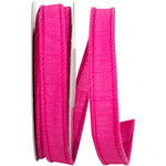 Load image into Gallery viewer, A partial, loose curl of the 7/8-inch wide Dupioni Supreme Wired Edge Ribbon, highlighting its solid vibrant fuchsia color, slubbed fabric texture, and a matching stitched wire edge.