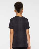 Load image into Gallery viewer, Back view of a young boy wearing the Black Reptile Youth Fine Jersey T-Shirt, showing the overall fit and seamless print coverage across the shoulders and back.
